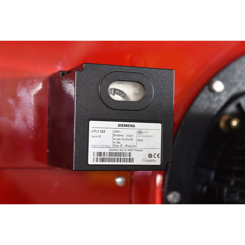 When starting an integrated oil burner in a cold environment, what preheating auxiliary measures should be taken?